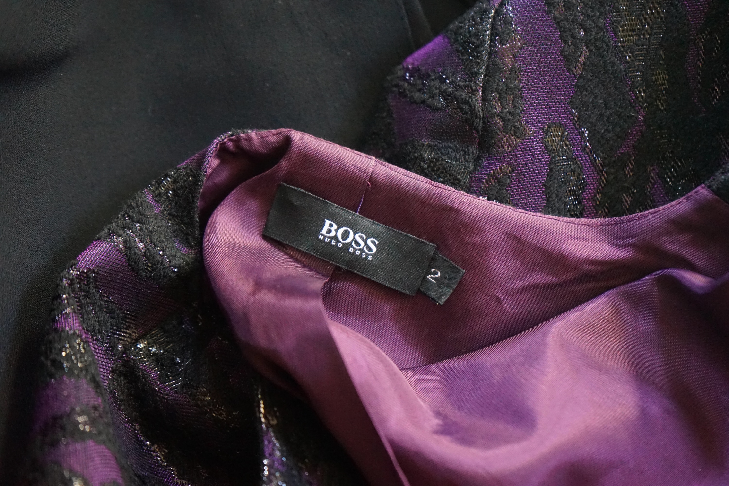 A lady's Boss (Hugo Boss) metallic purple and black evening jacket, three black skirts (Alexander McQueen, Emporio Armarni and Versace Classic) and a black sequin Ben de Lisi vest top, all approx. size 10